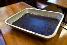 A blue jellylike substance in a silver dish