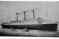 A large ocean liner with three funnels belching smoke.