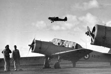 A blue and silver plane with two propellers