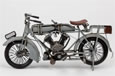 A vintage silver motorbike.