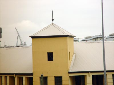 a small square tower coming out of a slanted roof