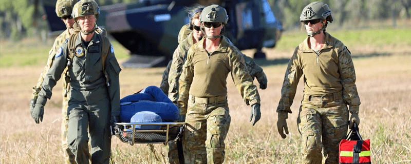 Australian Medivac army staff carrying a stretcher