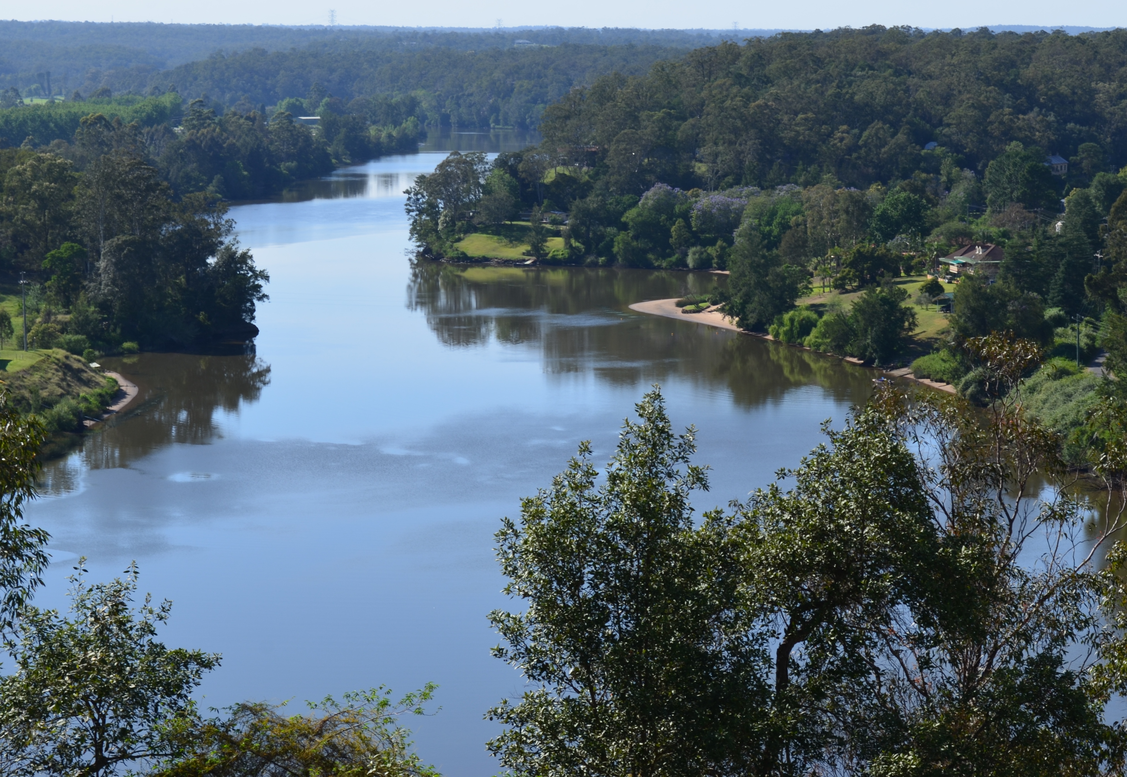 Looking down at the Hawksbury river showing the thick vegatation on either side of the river.