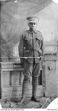 Studio photograph of an Aboriginal man in uniform Studio photograph of an Aboriginal man in uniform