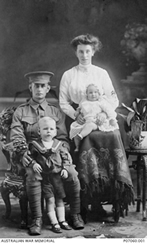 Studio photo of a soldier with his wife and two children Studio photo of a soldier with his wife and two children